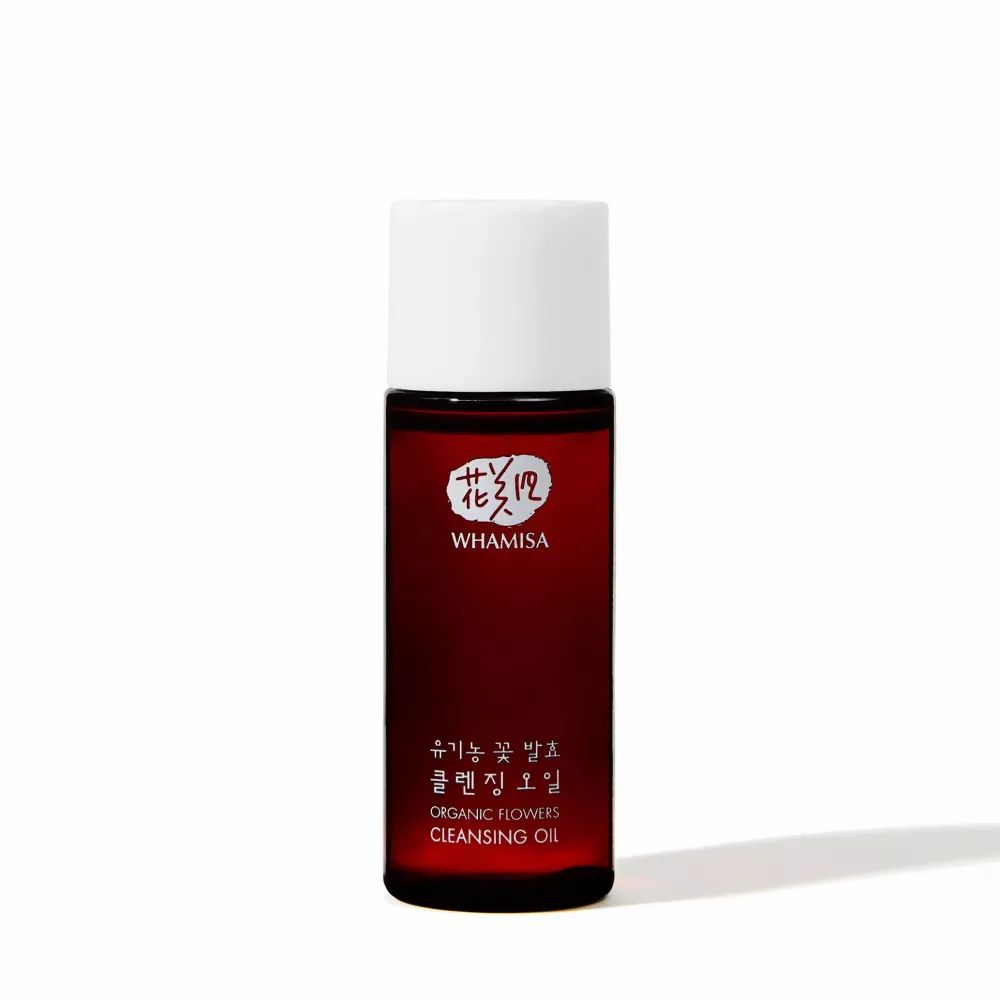 Kleine, zylindrische Flasche mit weißem Deckel. Aufschrift WHAMISA und koreanische Schriftzeichen. Untertitel: ORGANIC FLOWERS CLEANSING OIL.