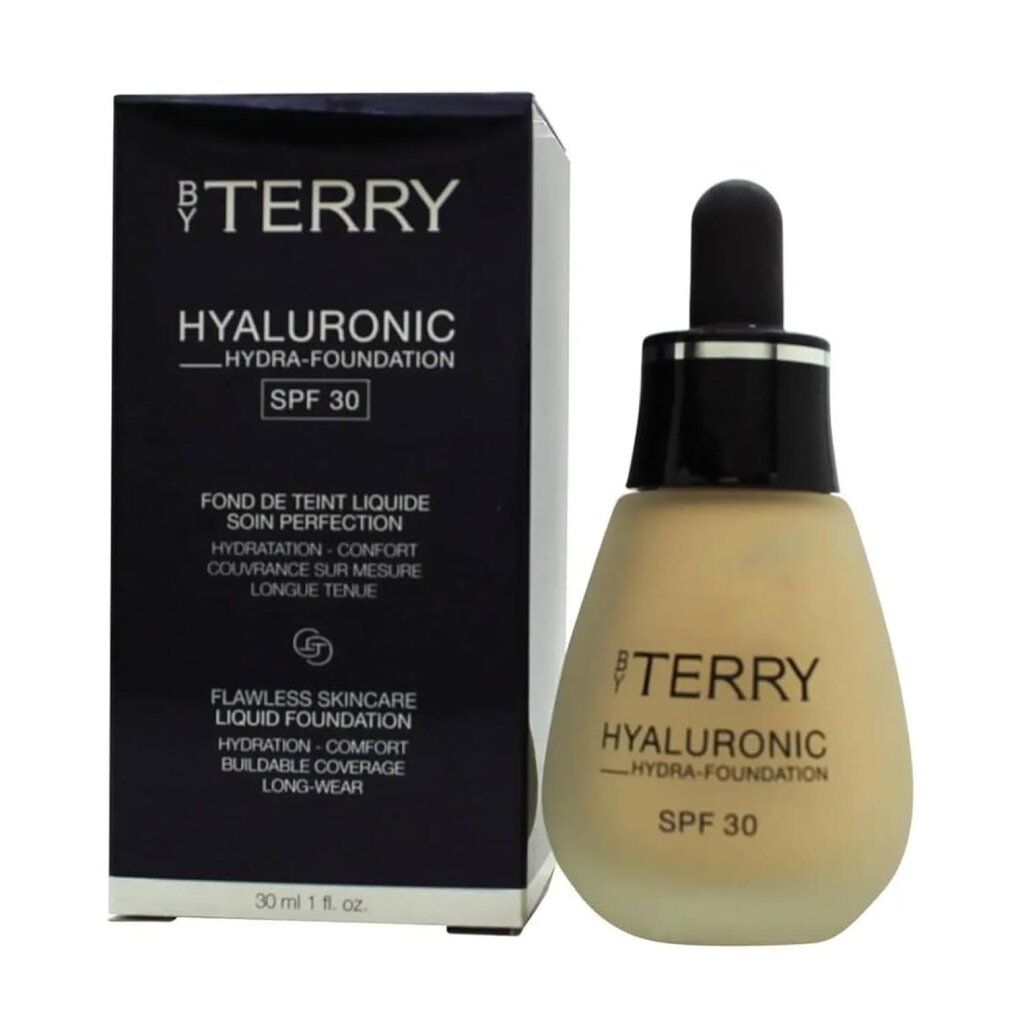 Foundation-Fläschchen mit Pipette und Verpackung. Aufschrift: BY TERRY, HYALURONIC HYDRA-FOUNDATION SPF 30. 30 ml.