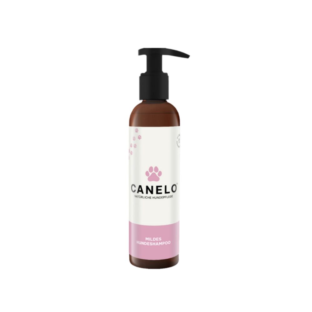 Braune Flasche mit schwarzem Pumpkopf. Aufschrift CANELO, Pfotenabdruck, darunter „Mildes Hundeshampoo“.