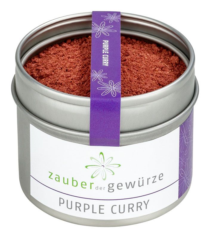 Runde Dose mit lila Curry-Pulver. Weißes Etikett mit Text und lila Band mit Aufschrift 'Purple Curry'.