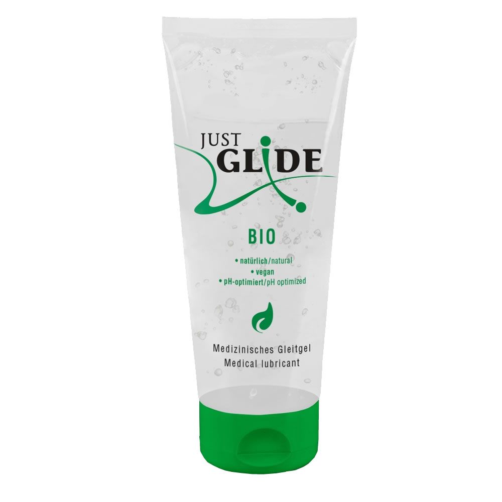 Durchsichtige Tube mit grünem Verschluss. Text: JUST GLIDE BIO, vegan, pH-optimiert, Medizinische Gleitmittel.