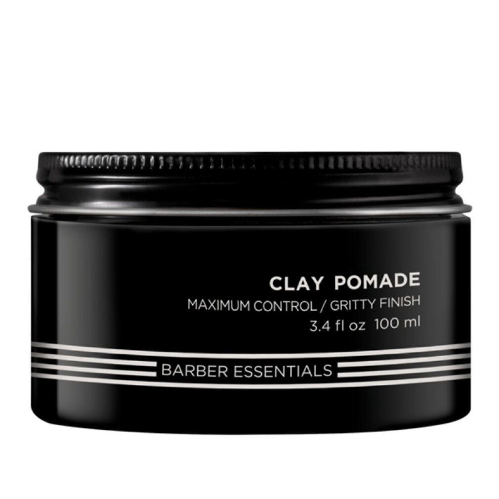 Schwarze Dose mit Deckel. Aufschrift: Clay Pomade, Barber Essentials. 3.4 fl oz 100 ml.