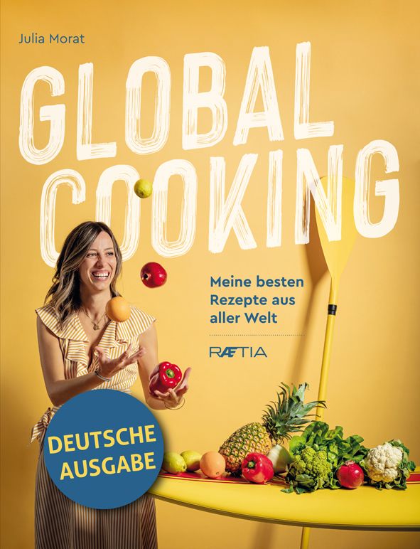 Buchcover mit dem Titel "GLOBAL COOKING". Frau jongliert mit Früchten. Aufschrift "Deutsche Ausgabe".