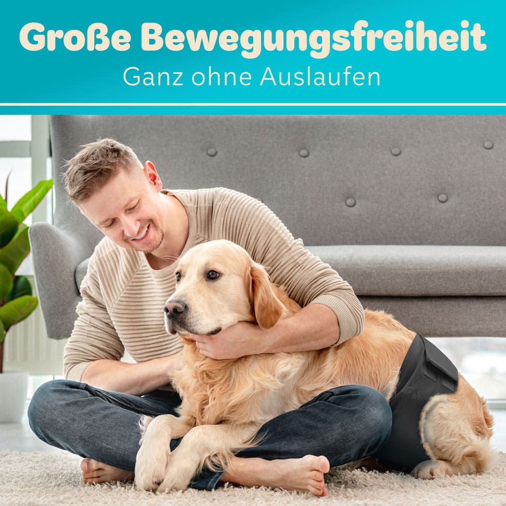 Mann und Hund auf dem Sofa. Hund trägt eine schwarze Windel. Text: Große Bewegungsfreiheit.