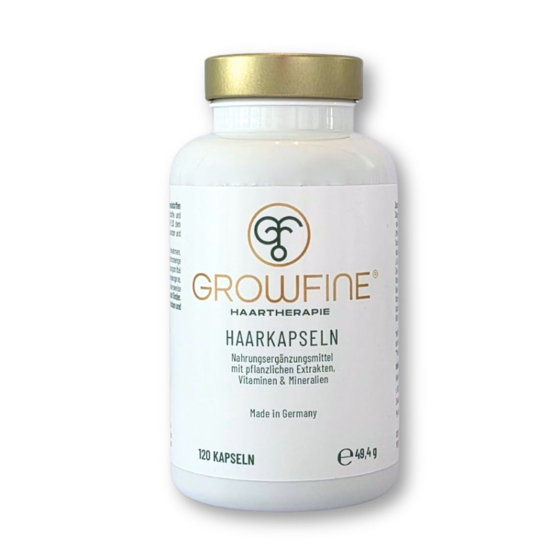 Weiße Flasche Growfine® Haarkapseln. Aufschrift: Growfine®, Haarkapseln, Nahrungsergänzungsmittel mit pflanzlichen Extrakten, Vitaminen & Mineralien.
