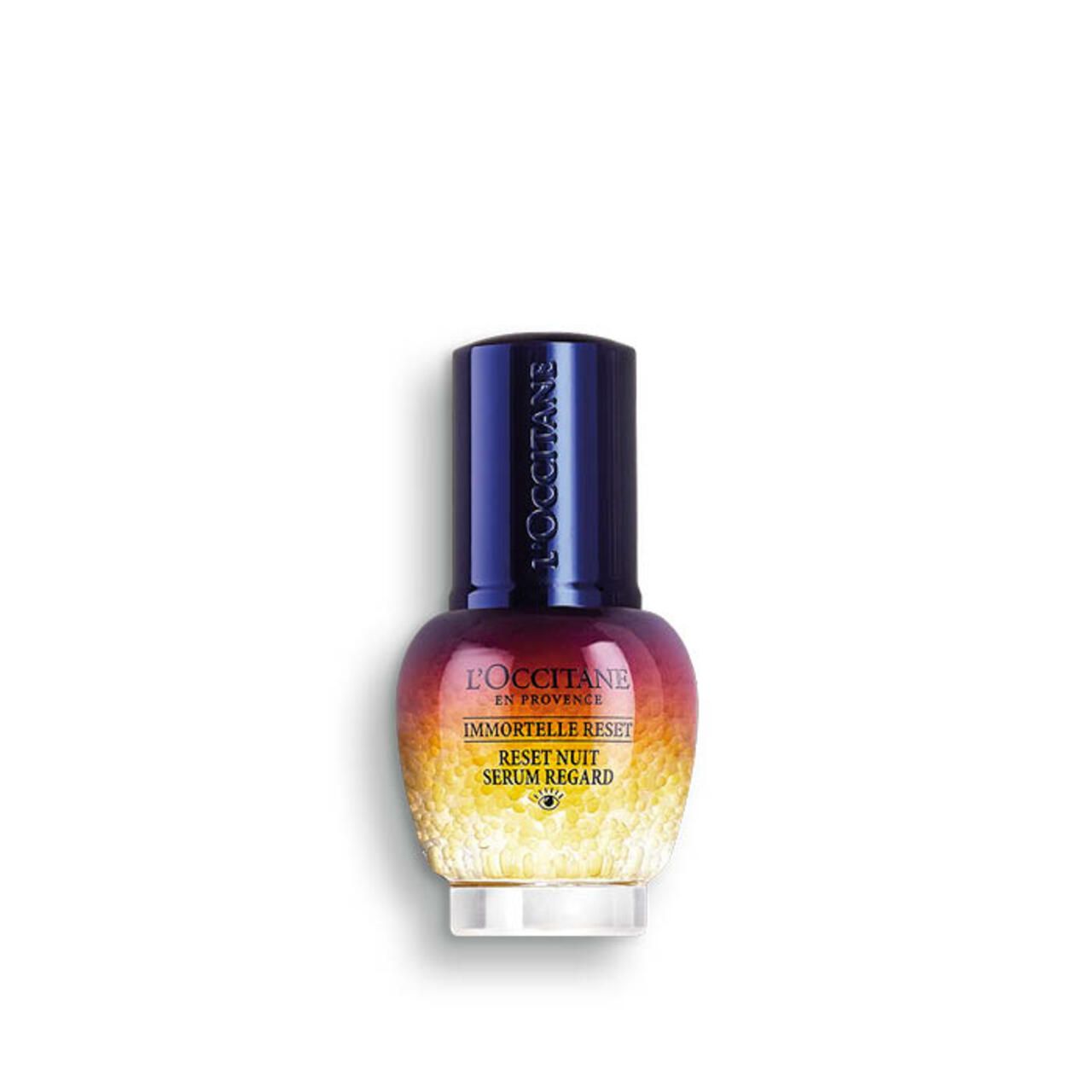 Kleine, runde Flasche mit blauem Deckel. Farbverlauf von Rot nach Gelb. Text: Immortelle Reset Serum Regard.