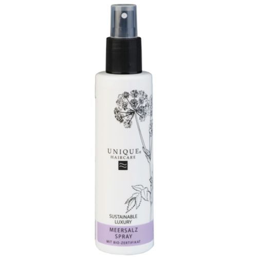 Sprühflasche mit schwarzem Sprühkopf. Aufschrift: UNIQUE HAIRCARE, Meersalz Spray, Bio-Zertifikat.