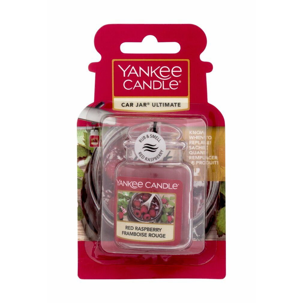 Roter Himbeere Ultimate Car Jar. Rotes Glas mit Deckel, Etikett mit Himbeeren. Verpackung mit Aufhängeloch. Text: Yankee Candle, Red Raspberry.
