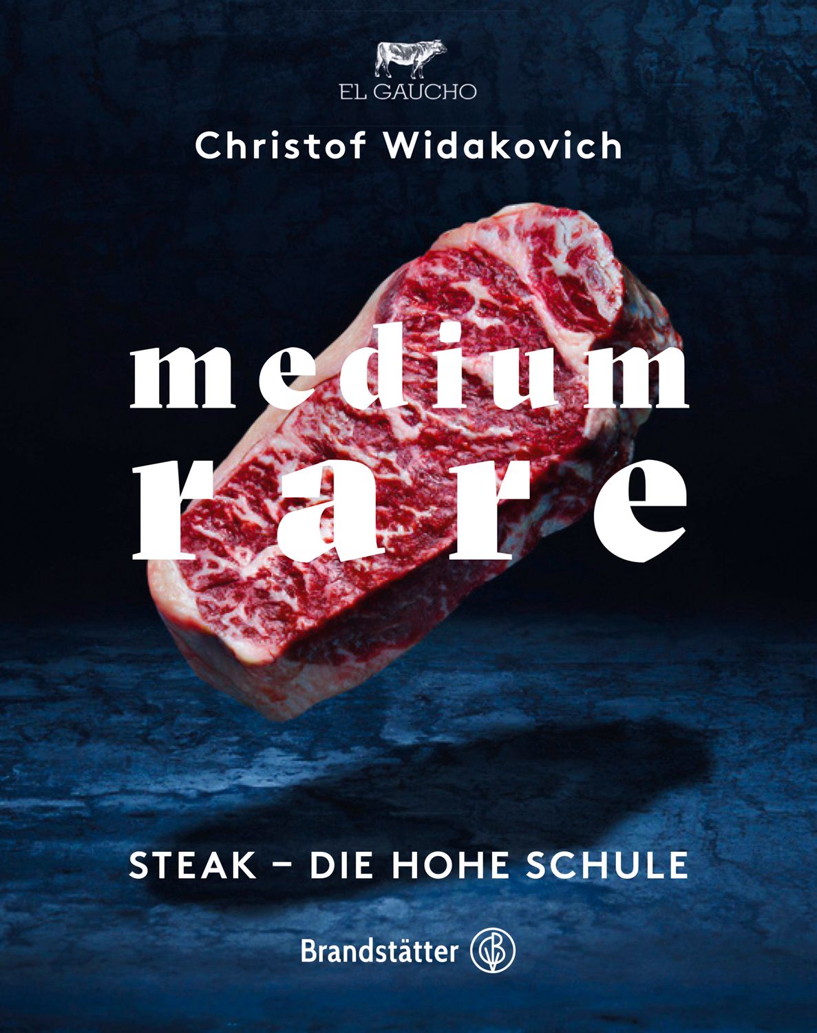 Buchcover mit einem Stück Fleisch. Titel: medium rare. Autor: Christof Widakovich. Verlag: Brandstätter.