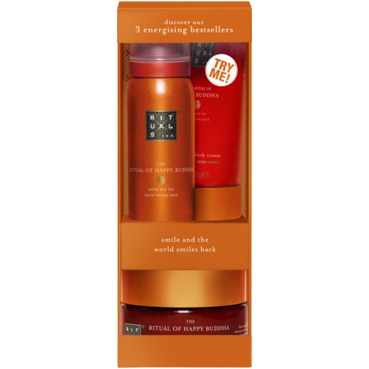 Geschenkset mit drei Produkten. Enthält Duschschaum, Körperpeeling und Körpercreme. Orangefarbene Verpackung mit Produktnamen.