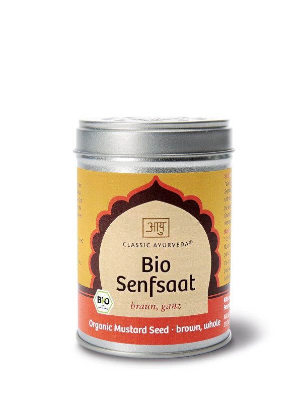 Zylindrische Dose mit Deckel. Aufschrift: Classic Ayurveda, Bio Senfsaat, braun, ganz. Bio-Siegel. Aufschrift: Organic Mustard Seed - brown, whole.