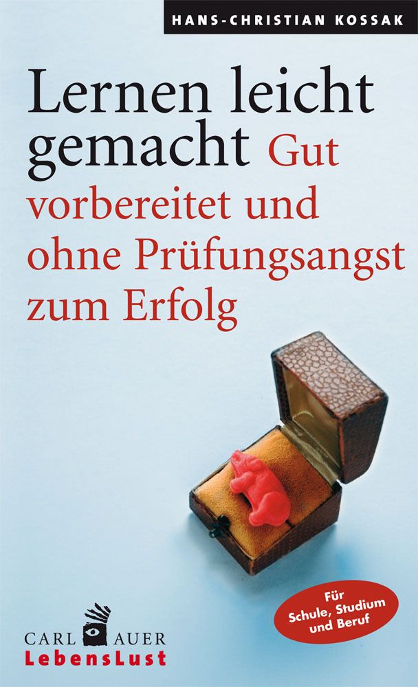 Buchcover: "Lernen leicht gemacht". Titel und Autor sichtbar. Geöffnete Schmuckschatulle mit roter Figur.