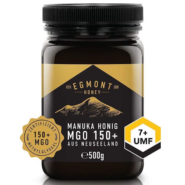 Glas Honig mit schwarzem Deckel. Etikett mit "Egmont Honey", "Manuka Honig MGO 150+" und Zertifizierungen.