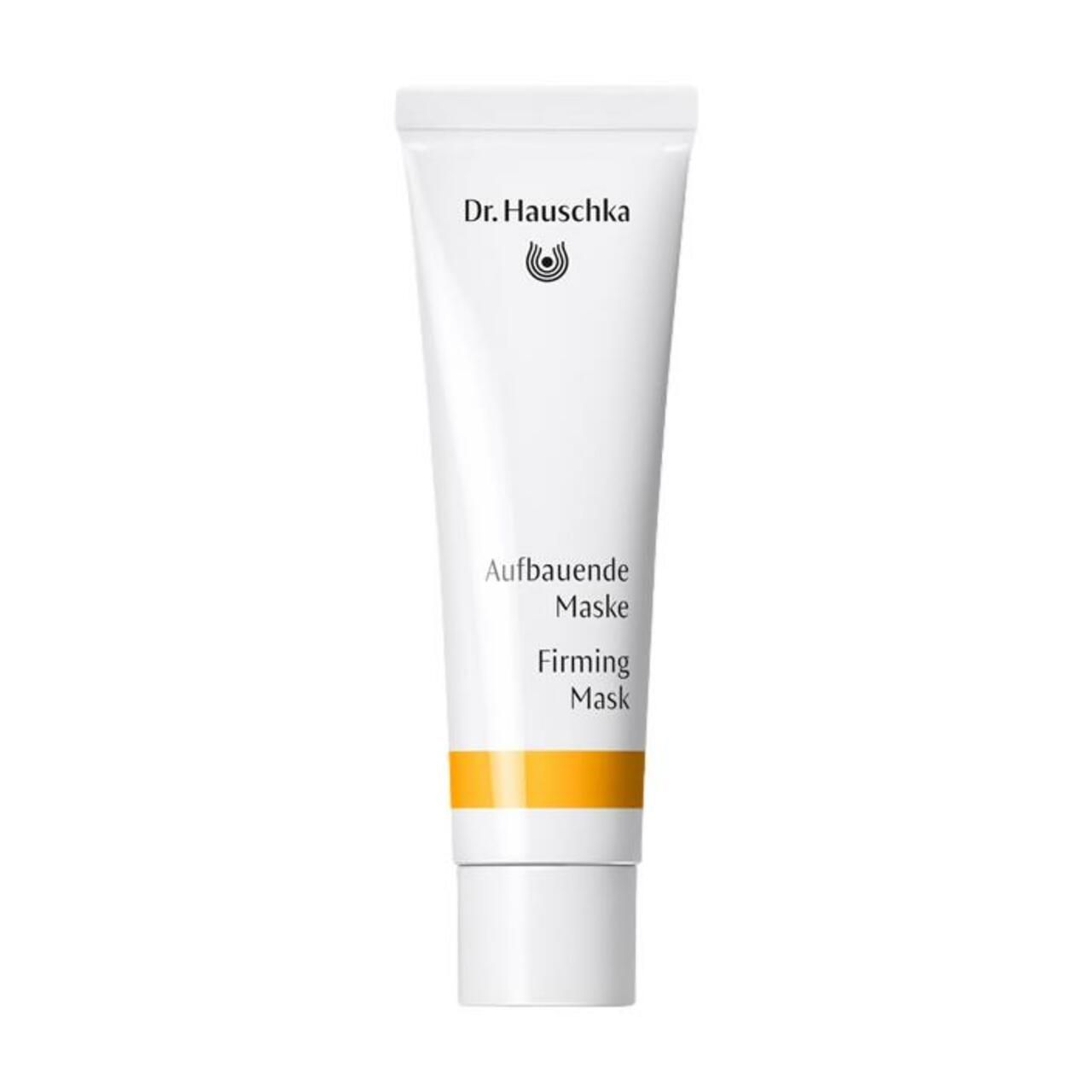 Weiße Tube mit gelbem Streifen. Aufschrift: Dr. Hauschka, Aufbauende Maske, Firming Mask.