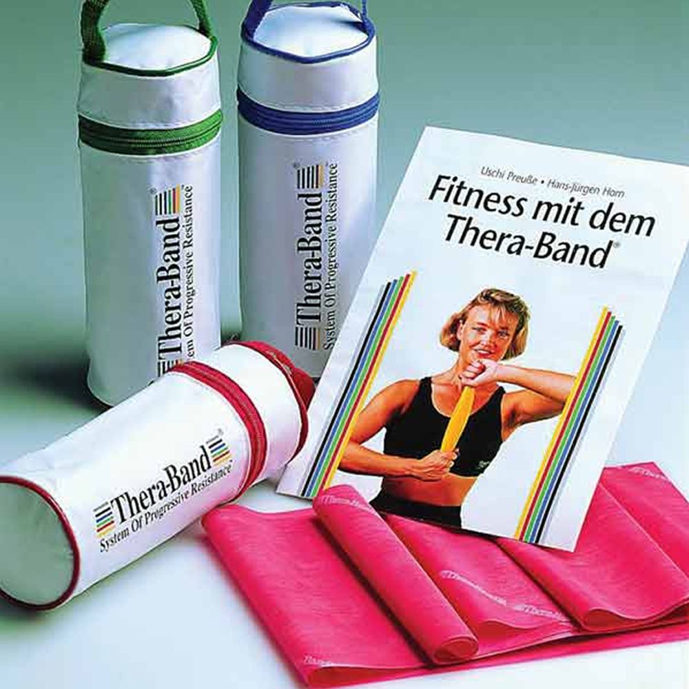 Drei weiße Zylinder mit farbigen Reißverschlüssen und Griffen. Rosa Theraband und Broschüre mit dem Titel "Fitness mit dem Thera-Band".