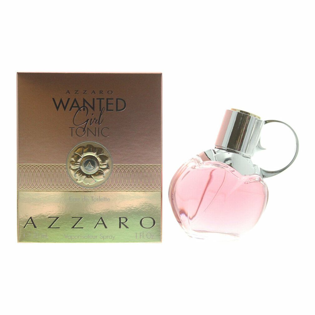 Azzaro Wanted Girl Tonic Eau De Toilette Spray. Rosa Flakon in Granatenform, silberner Verschluss. Goldfarbene Verpackung mit Produktnamen.