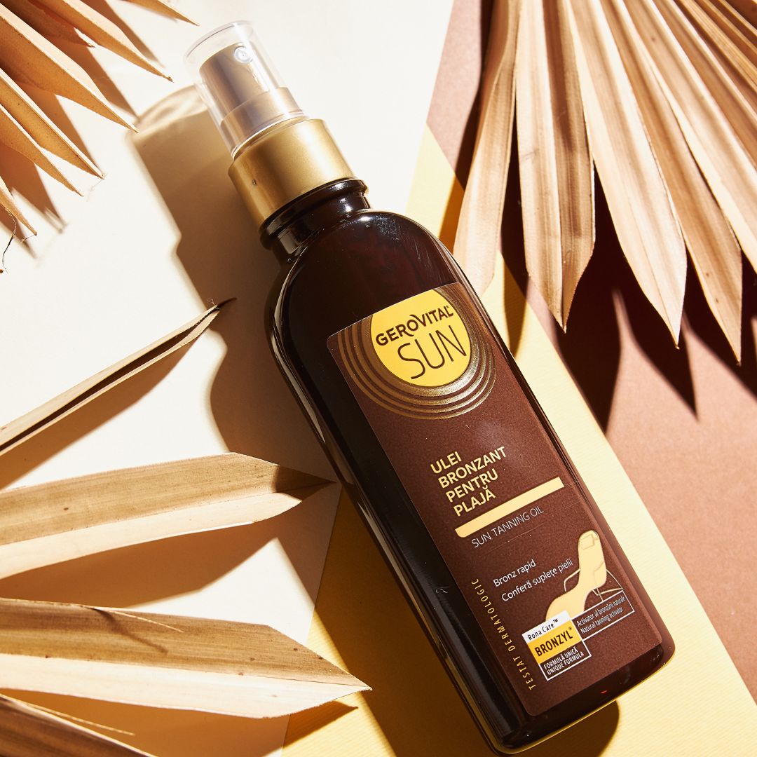Gerovital Sun Bräunungsöl, braune Flasche mit Sprühkopf. Aufschrift: Ulei Bronzant Pentru Plaja, Sun Tanning Oil. Hintergrund: Blätter.