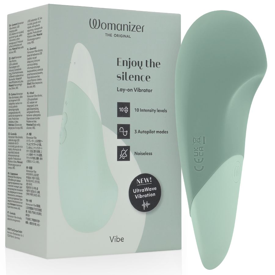 Mintfarbener Vibrator und Verpackung. Aufschrift: Womanizer, Enjoy the silence, 10 Intensitätsstufen, 3 Modi, geräuschlos, UltraWave Vibration.