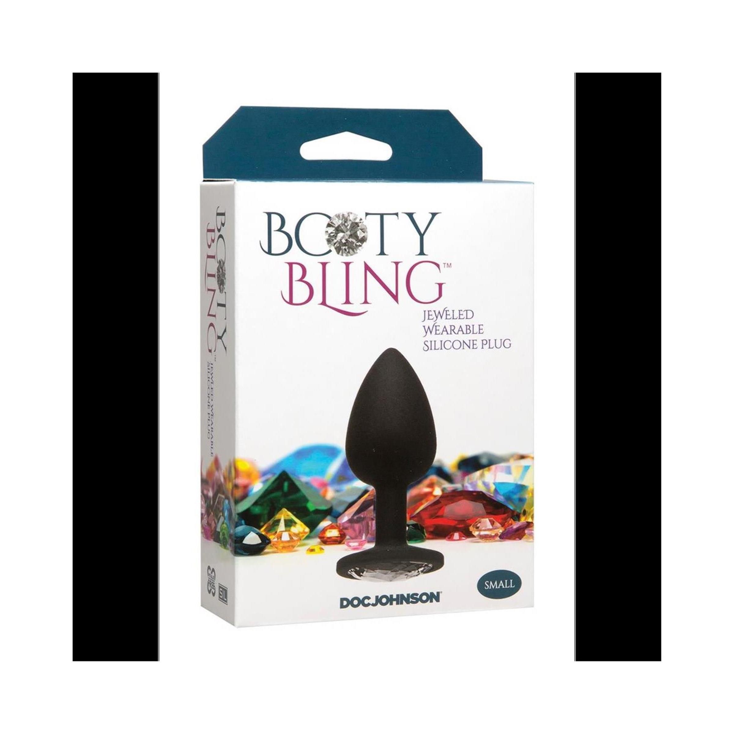 Schwarzer, spatenförmiger Silikon-Butt-Plug in Verpackung. Aufschrift "Booty Bling" und "Doc Johnson". "Small" Größe.