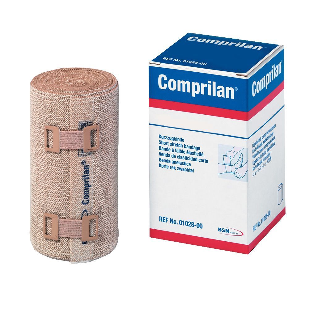 Beige elastische Kurzzugbinde mit Klettverschlüssen und Karton. Aufschrift: Comprilan.