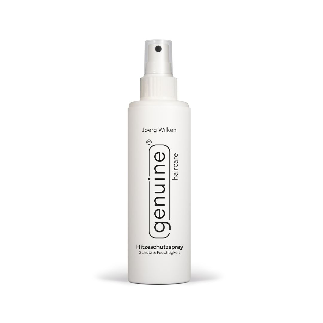 Weiße Sprühflasche mit schwarzem Sprühkopf. Beschriftung: genuine haircare, Hitzeschutzspray, Schutz & Feuchtigkeit.