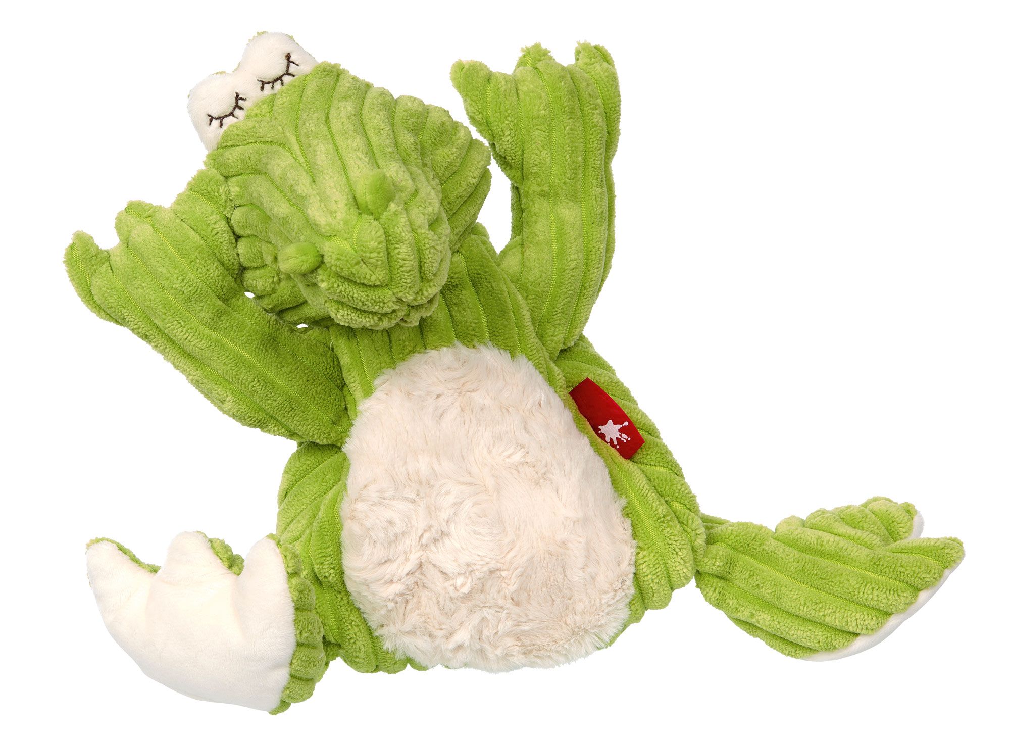 Grünes Stoffkrokodil mit weißem Bauch und geschlossenen Augen. Rotes Etikett mit weißem Stern. Cordstoff.
