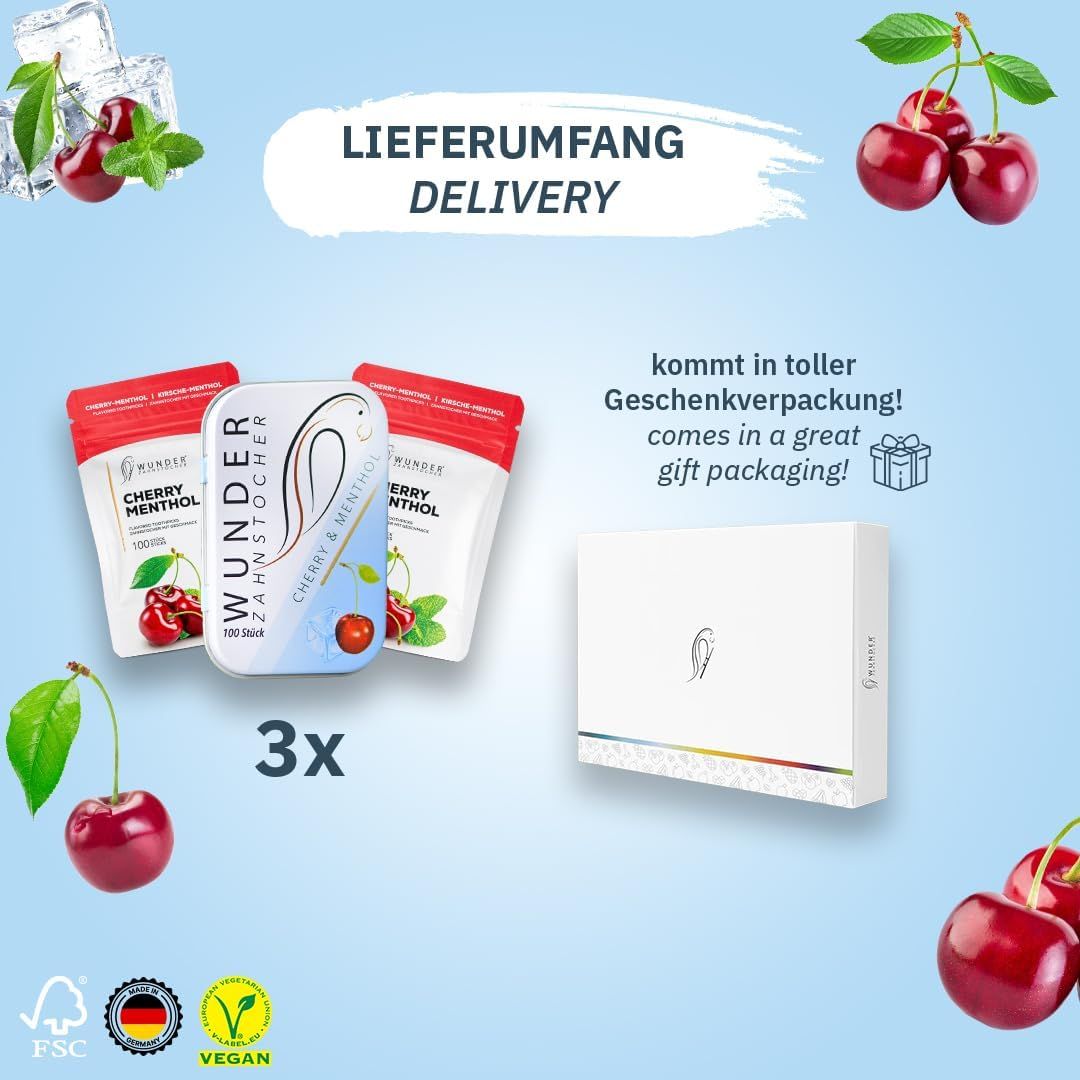 Drei Packungen Zahnstocher mit Kirsch-Menthol-Geschmack, eine Metallbox, eine Geschenkbox, Kirschen.