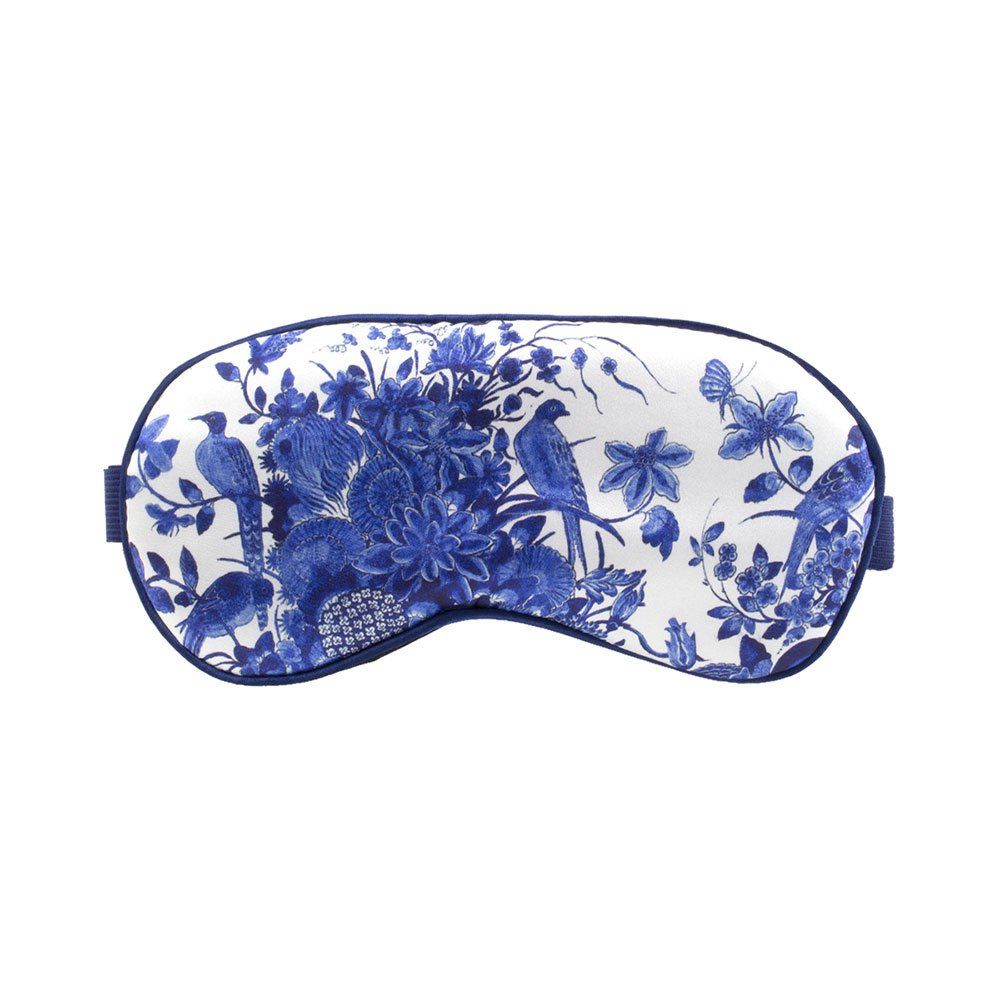 Schlafmaske mit blau-weißem Blumen- und Vogelmuster. Elastisches Band. Oval geformt.