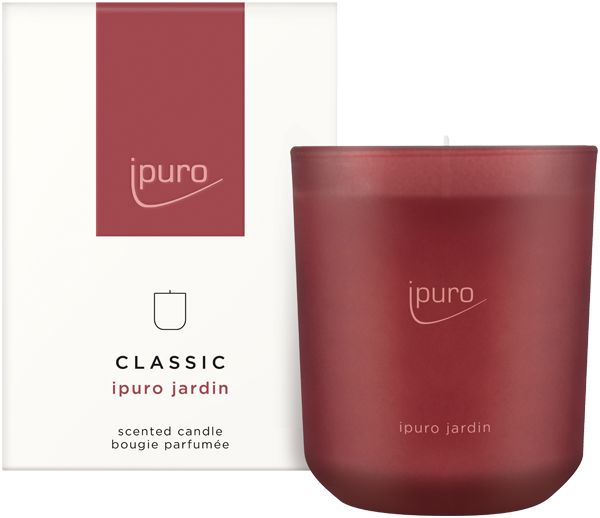 Rote Duftkerze und Verpackung. Aufschrift: Ipuro, Classic Jardin. Kerze im Glas.