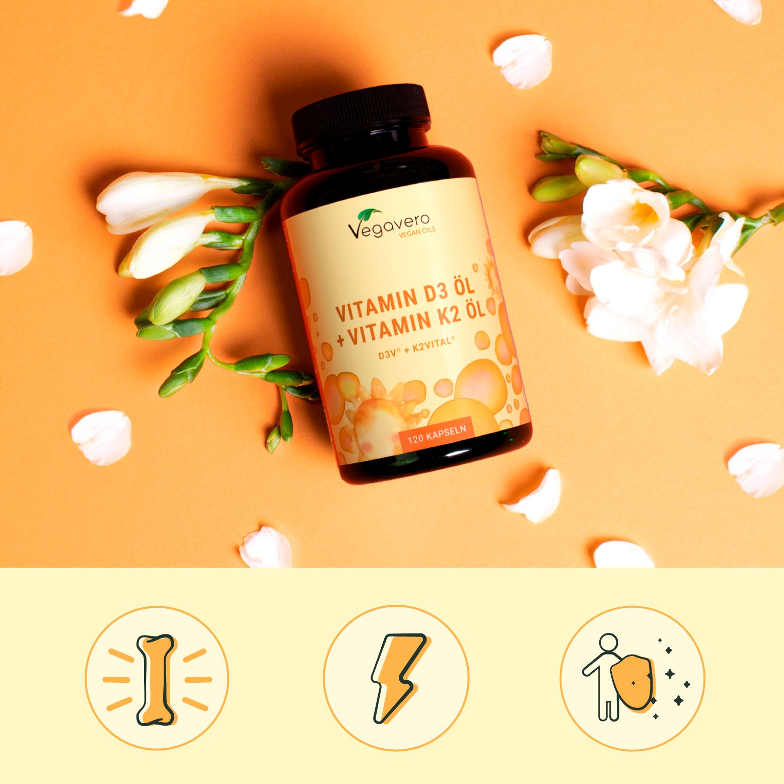 Flasche mit Etikett: Vitamin D3 Öl + Vitamin K2 Öl. 120 Kapseln. Symbole: Knochen, Blitz, Schutzschild. Orangefarbener Hintergrund.