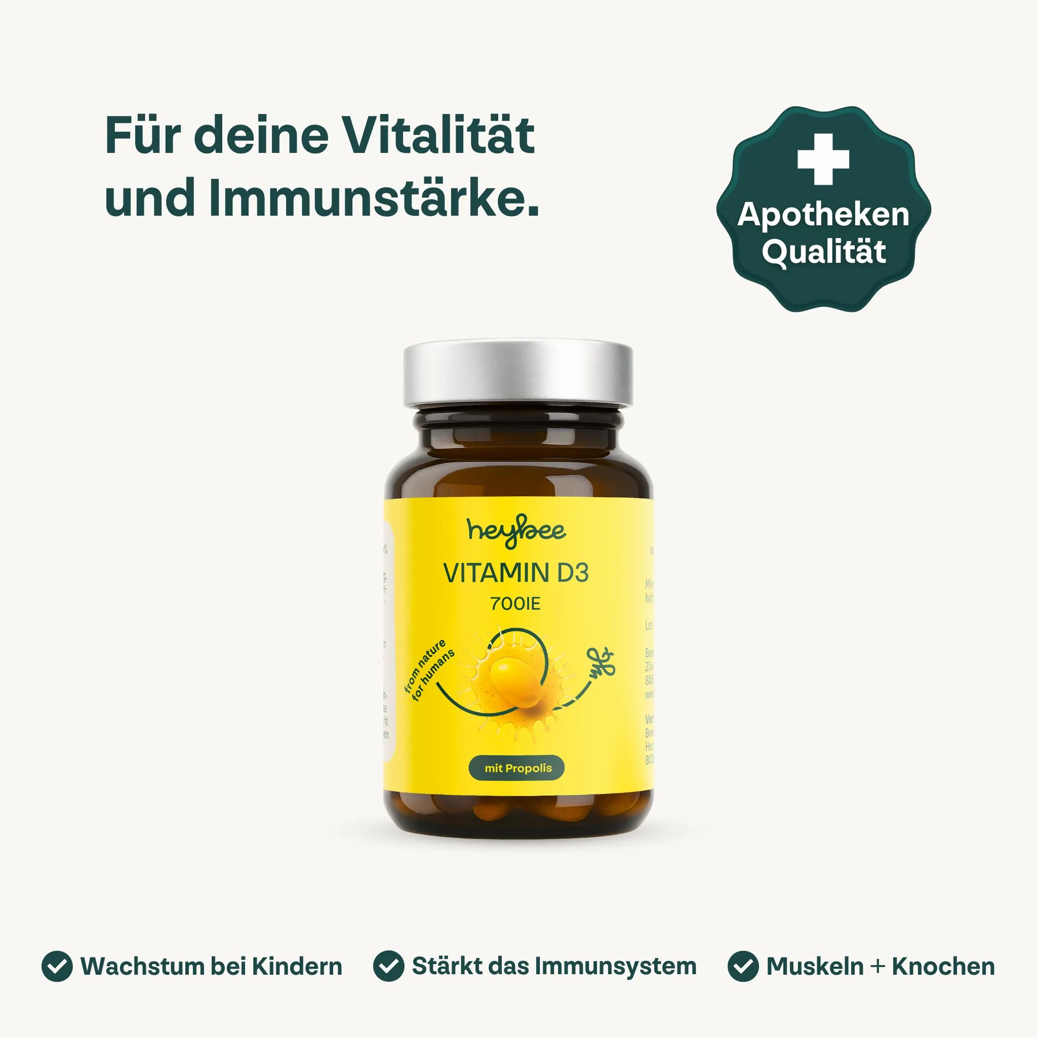 Braune Glasflasche mit gelbem Etikett. Aufschrift: Heybee Vitamin D3 700IE + Propolis. Apotheken Qualität Siegel.