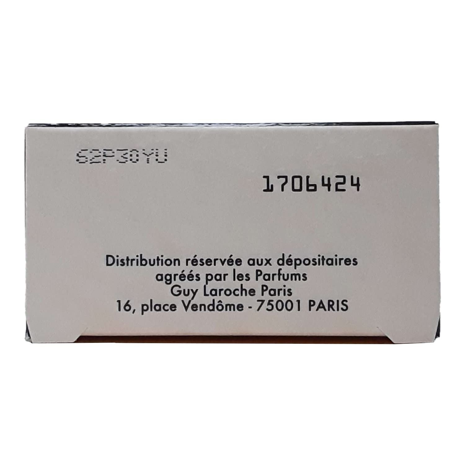 Rückseite der Verpackung von Guy Laroche Fidji Eau de Toilette. Text mit Informationen und Adressdaten.