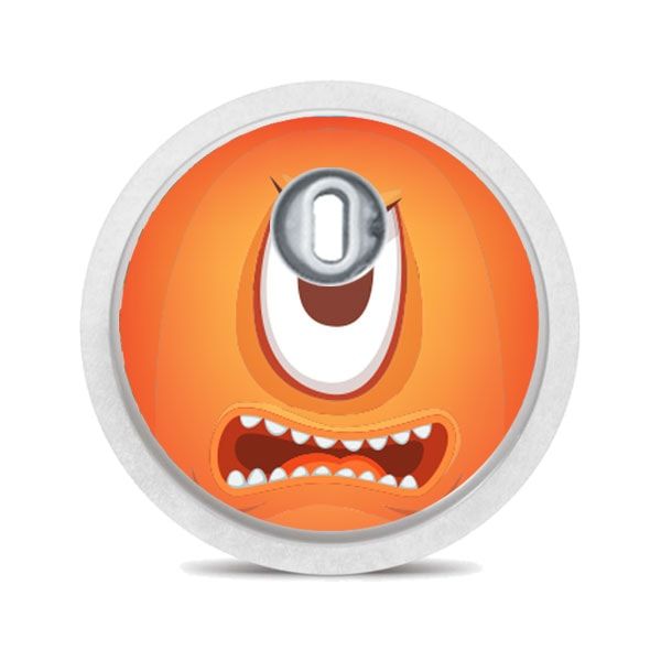 Runder Aufkleber mit orangefarbenem Monstergesicht. Ein Auge, Zähne. Mit silbernem Applikator.