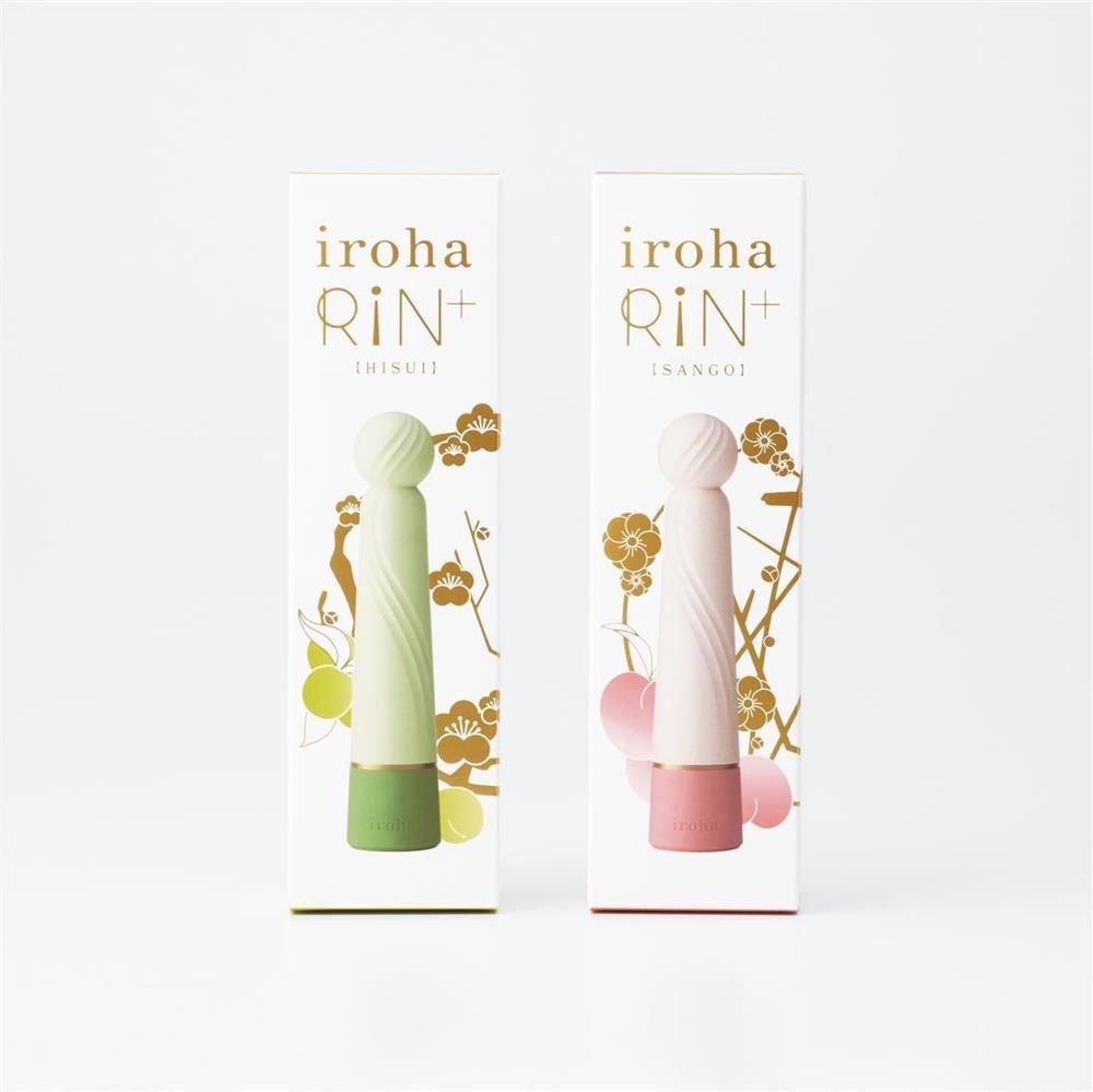 Zwei Produktverpackungen. Links: hellgrüner Vibrator. Rechts: rosa Vibrator. Beide mit goldener Schrift und floralen Motiven.