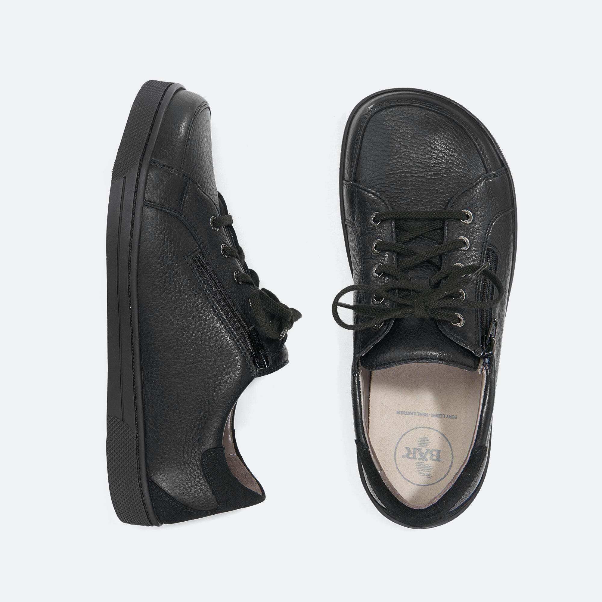 Schwarze Lederhalbschuhe mit Schnürung und seitlichem Reißverschluss.