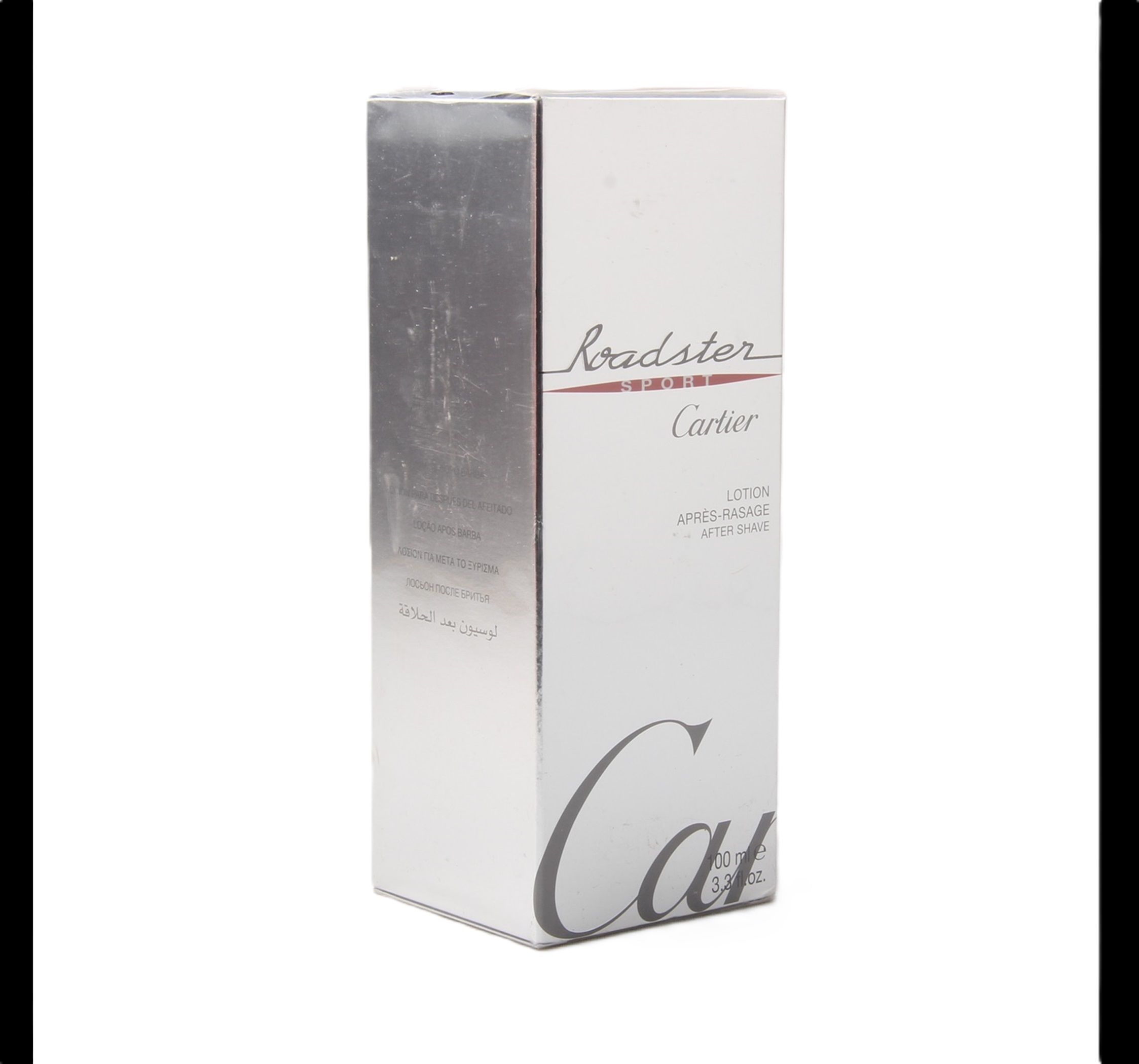 Weißer Karton mit silberner Seite. Aufschrift Roadster Sport, Cartier. Lotion Après Rasage.