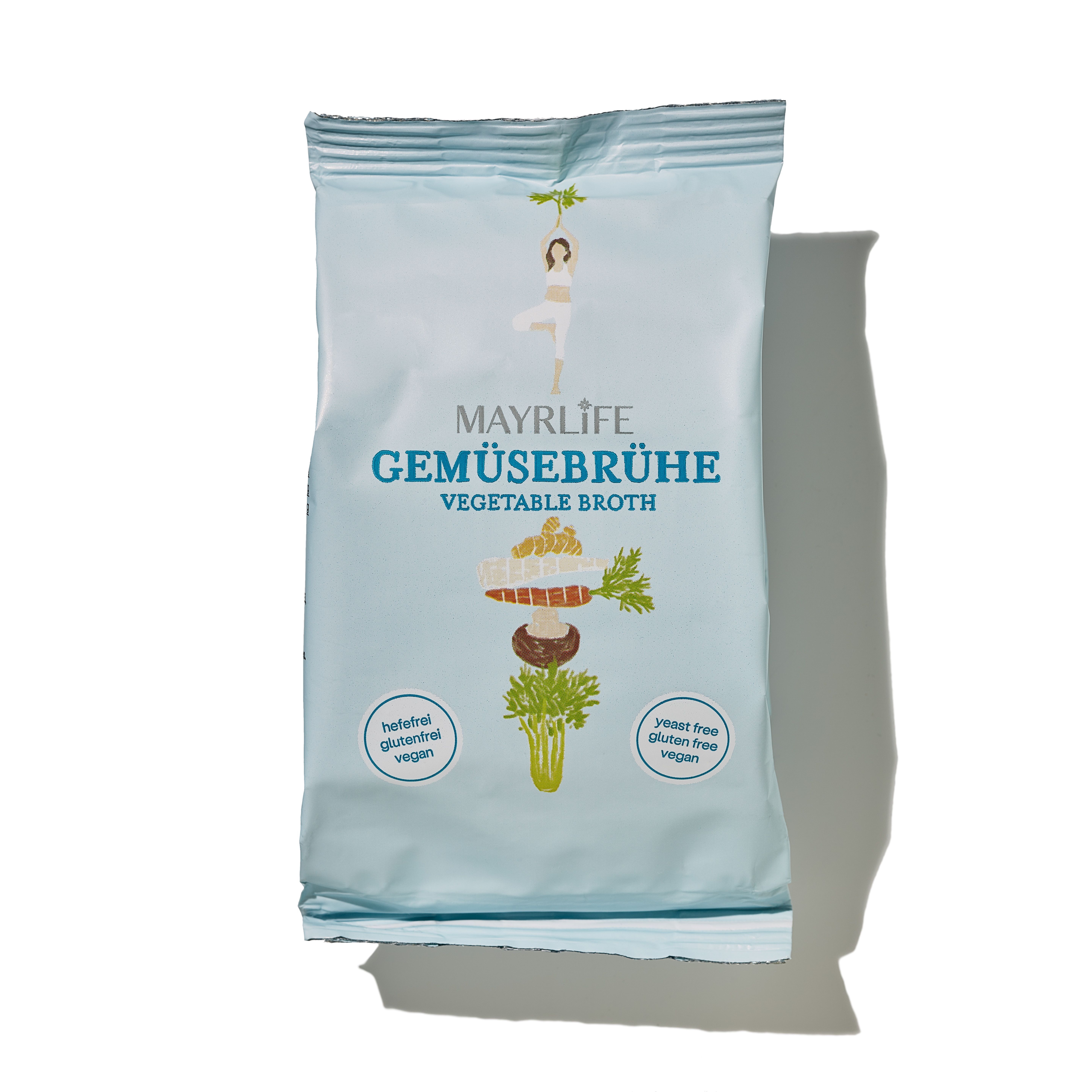 Hellblaue Verpackung mit MAYRLIFE Bio Gemüsebrühe. Schriftzug, Illustration von Gemüse, vegan, glutenfrei.