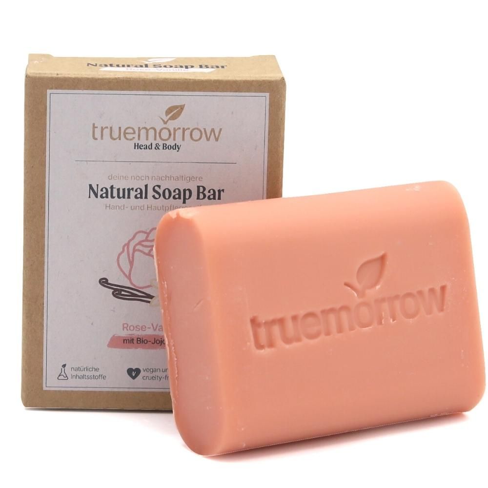 Rosa Seife mit Logo und Verpackung. Aufschrift: truemorrow Natural Soap Bar Rose-Vanille.