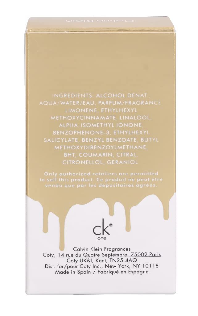 Rückseite der Verpackung. Inhaltsstoffe, Herstelleradresse, "ck one"-Logo. Tropfendes Design. Text in Englisch und Französisch.