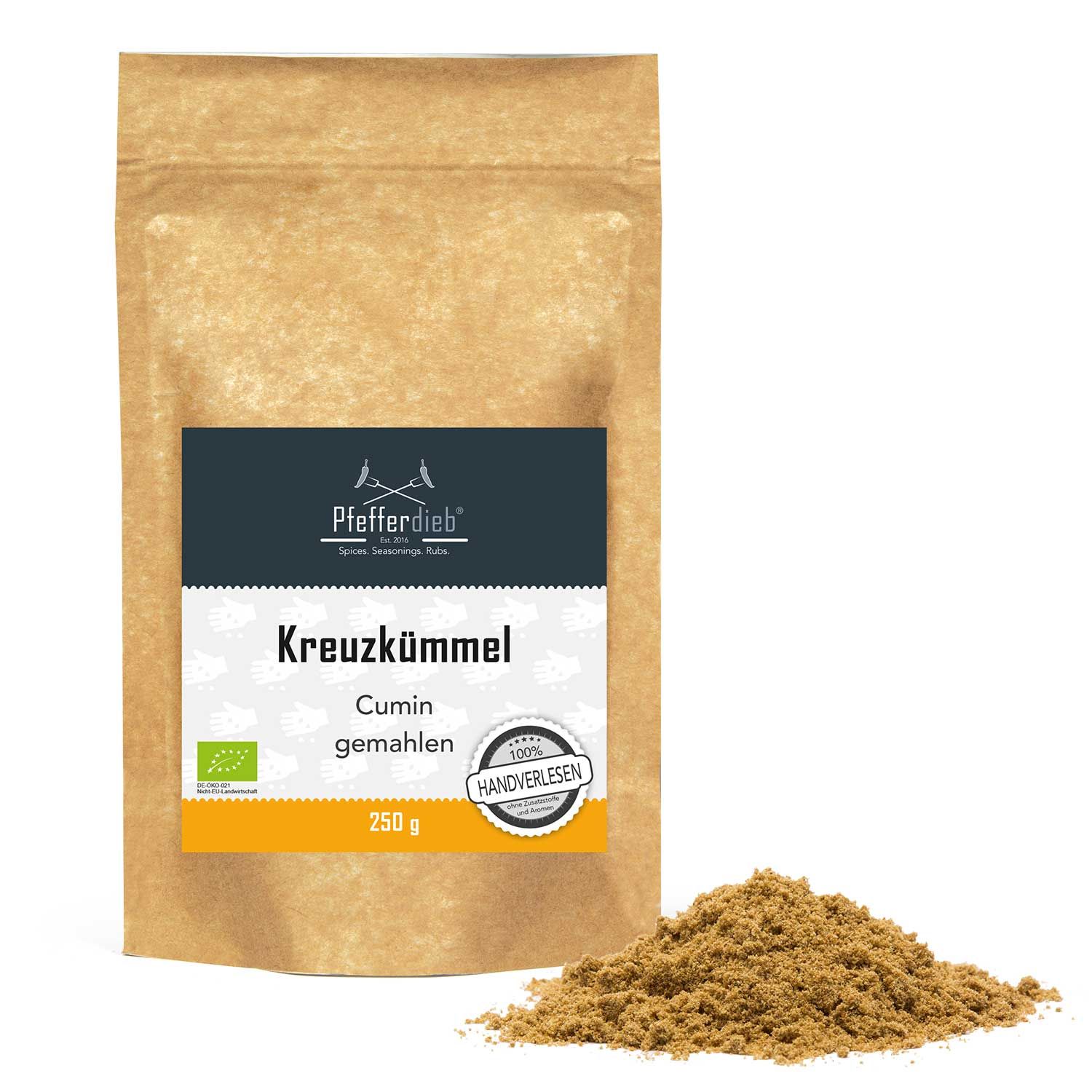 Braune Papiertüte mit Aufdruck und gemahlenem Kreuzkümmel. Label mit Produktname, Logo und Bio-Siegel. Handverlesen-Siegel.
