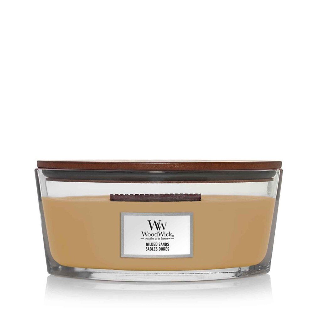 Duftkerze mit Holzdocht. Glasbehälter mit braunem Deckel. Aufkleber mit Logo und Schriftzug "Gilded Sands".