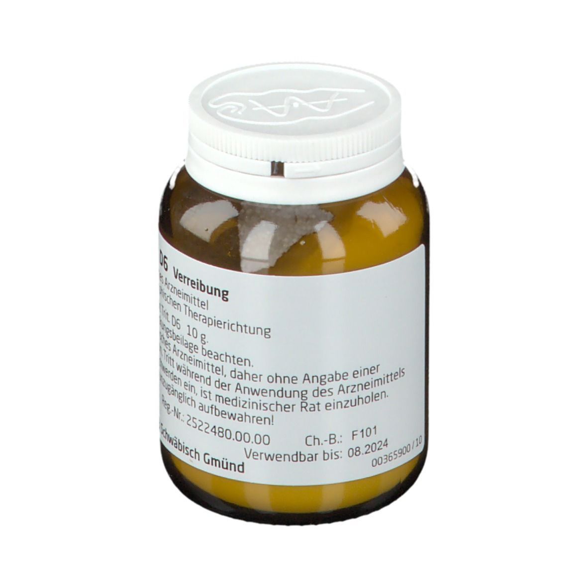 Braune Glasflasche mit weißem Deckel. Etikett mit Text: Magnesit D6 Verreibung, WELEDA. Verwendbar bis: 08.2024.