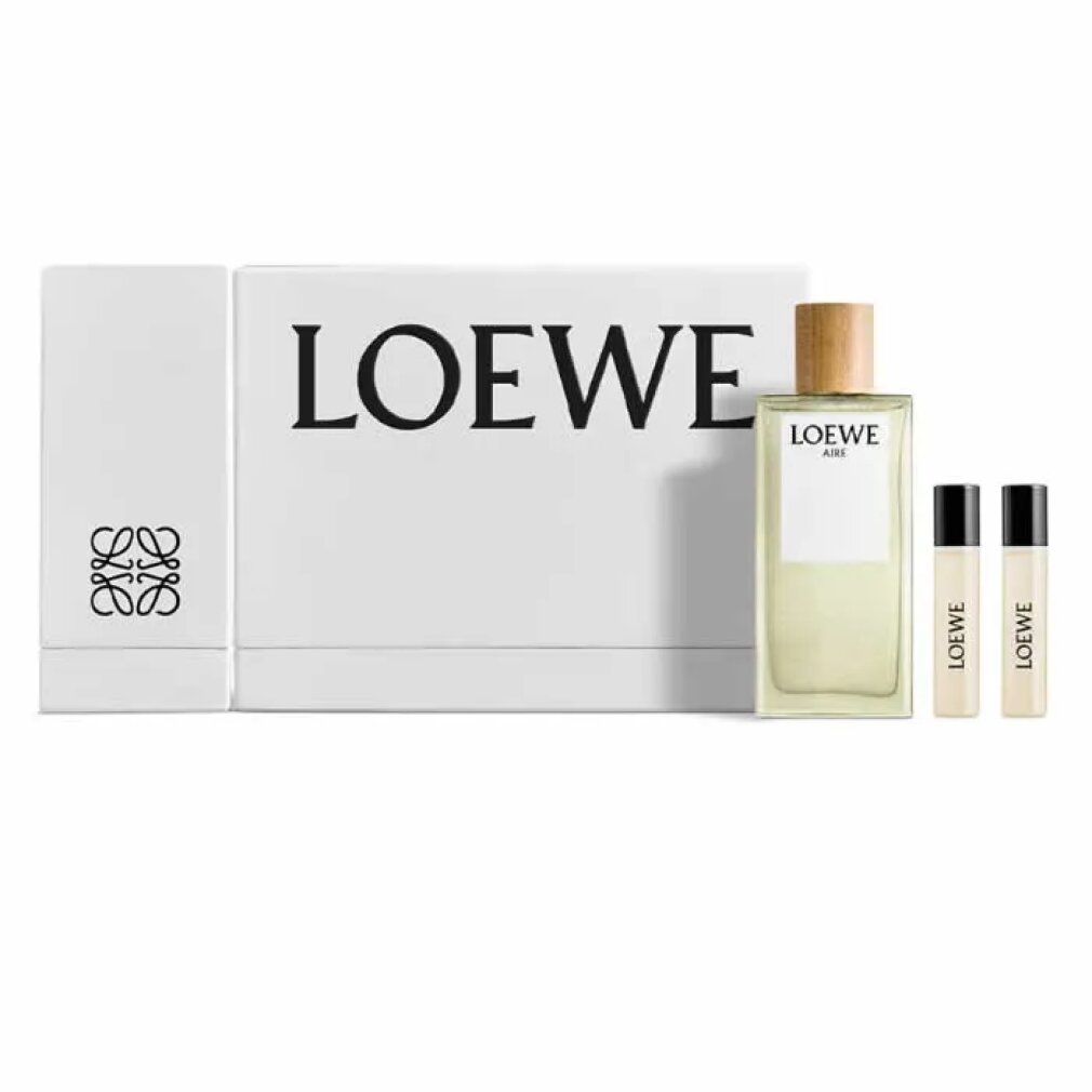 Weißer Karton mit LOEWE-Logo, Flakon und zwei Proben. Flakon mit Holzverschluss, helle Flüssigkeit. Proben mit schwarzem Deckel.