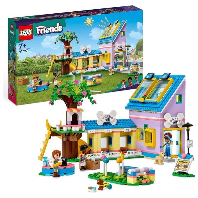 Il LEGO Friends 41727 Centro di Soccorso per Cani è un set di gioco per bambini dai 7 anni in su. Mostra un edificio colorato con diverse aree, tra cui una casa sull'albero e un percorso di addestramento. Sono incluse figurine e accessori per cani.