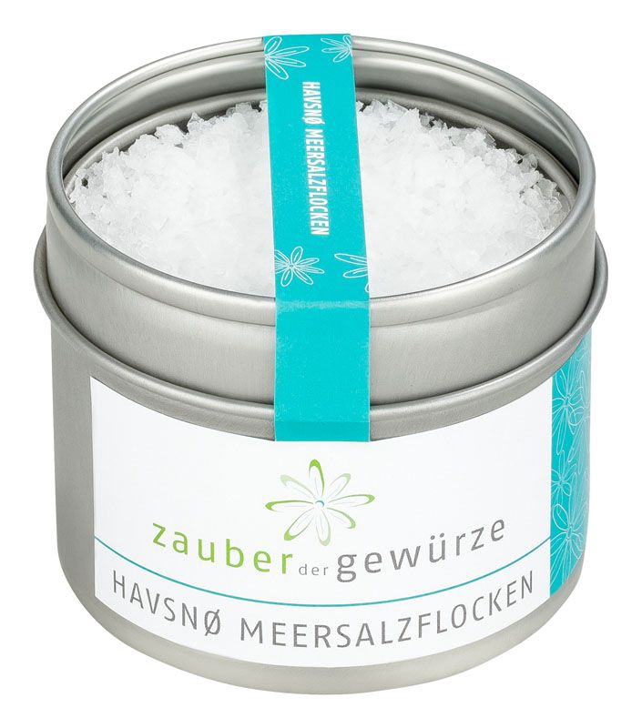 Runde Dose mit Meersalzflocken. Etikett mit Produktnamen und Logo. Türkisfarbenes Band mit Schriftzug.