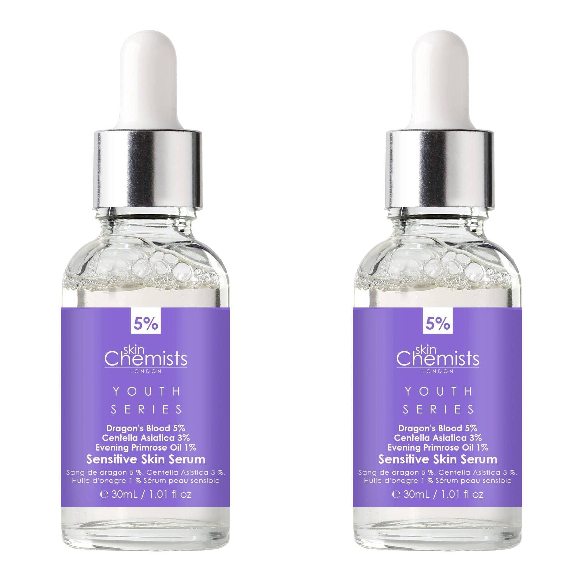 Zwei Flaschen SkinChemists Serum. Glasflaschen mit Pipette. Lila Etikett mit Text: Youth Series, Dragon's Blood 5%, Sensitive Skin Serum.