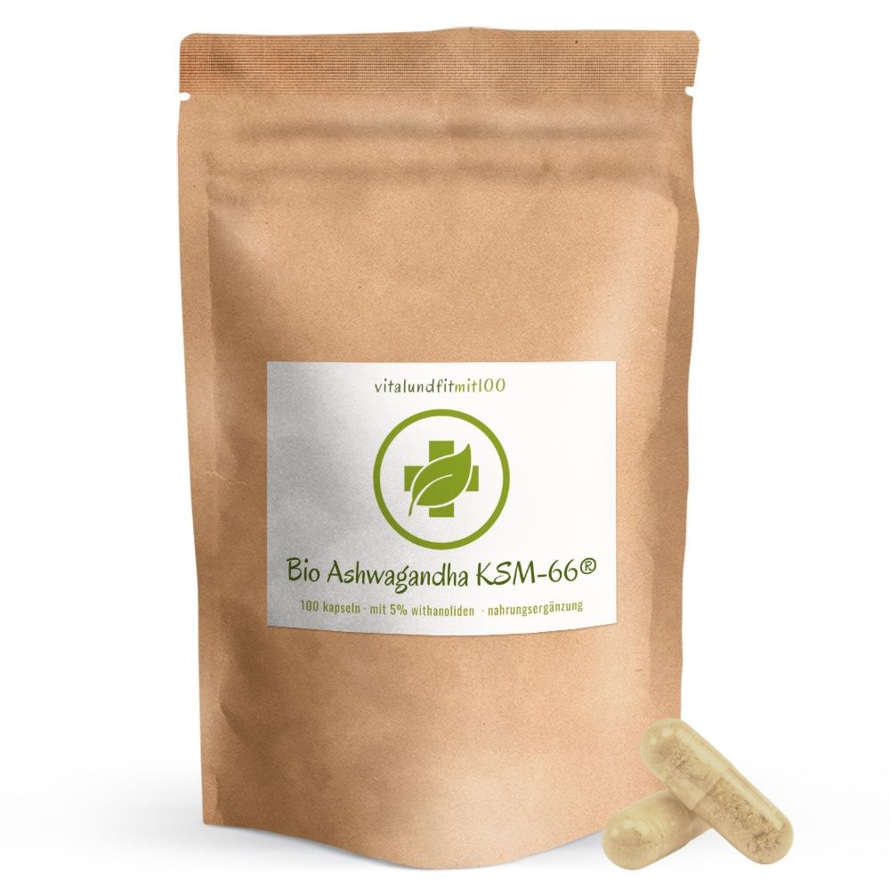 Braune Papierverpackung mit Aufdruck. Aufkleber mit Logo und Text: Bio Ashwagandha KSM-66 Kapseln. Zwei Kapseln liegen daneben.