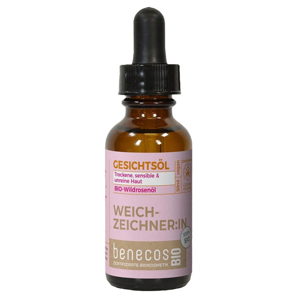 Braune Glasflasche mit Pipettenverschluss. Rosa Etikett mit "benecos BIO Gesichtsöl BIO-Wildrosenöl".