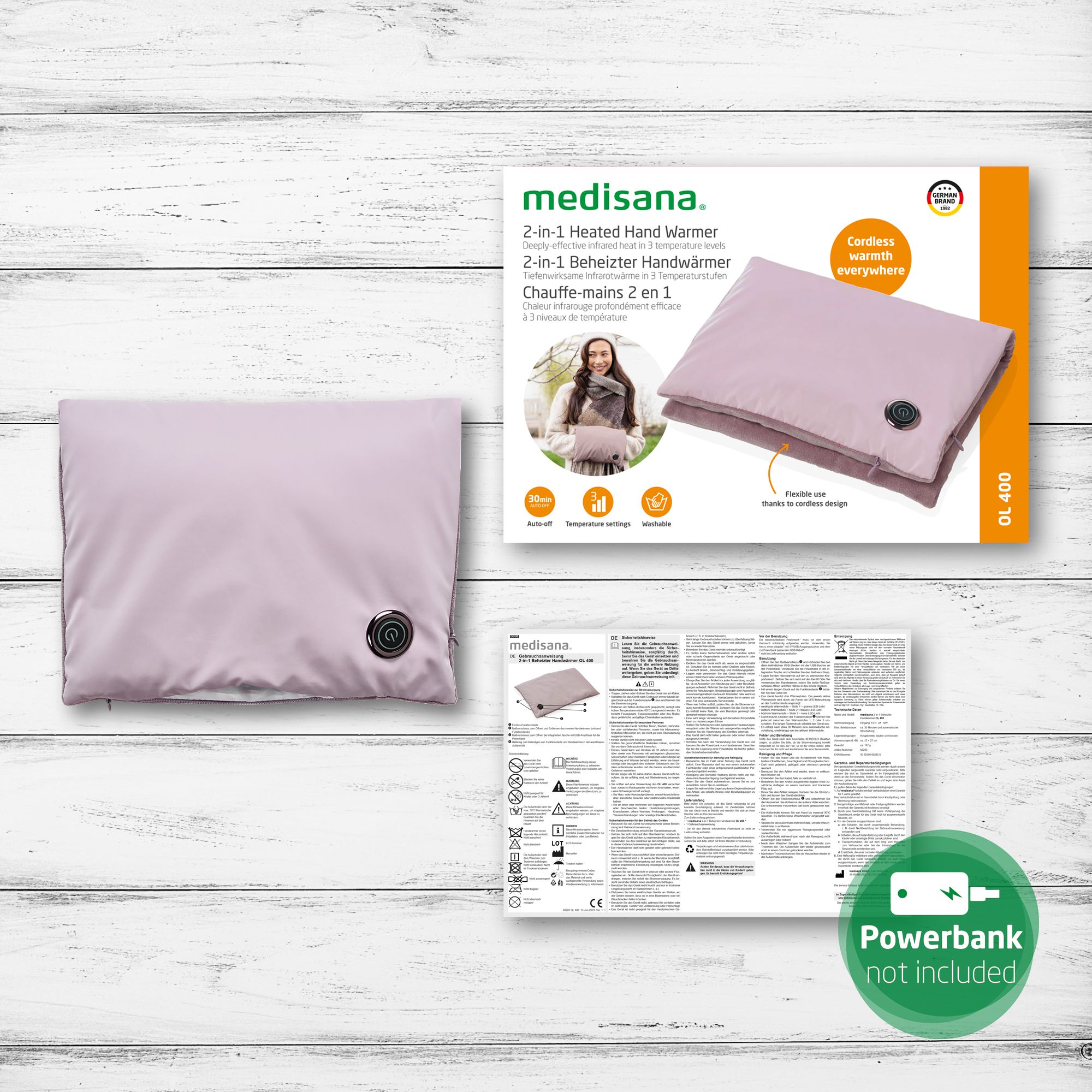 Verpackung mit helllila Handwärmer. Produktname: medisana. Zubehör: Anleitung.