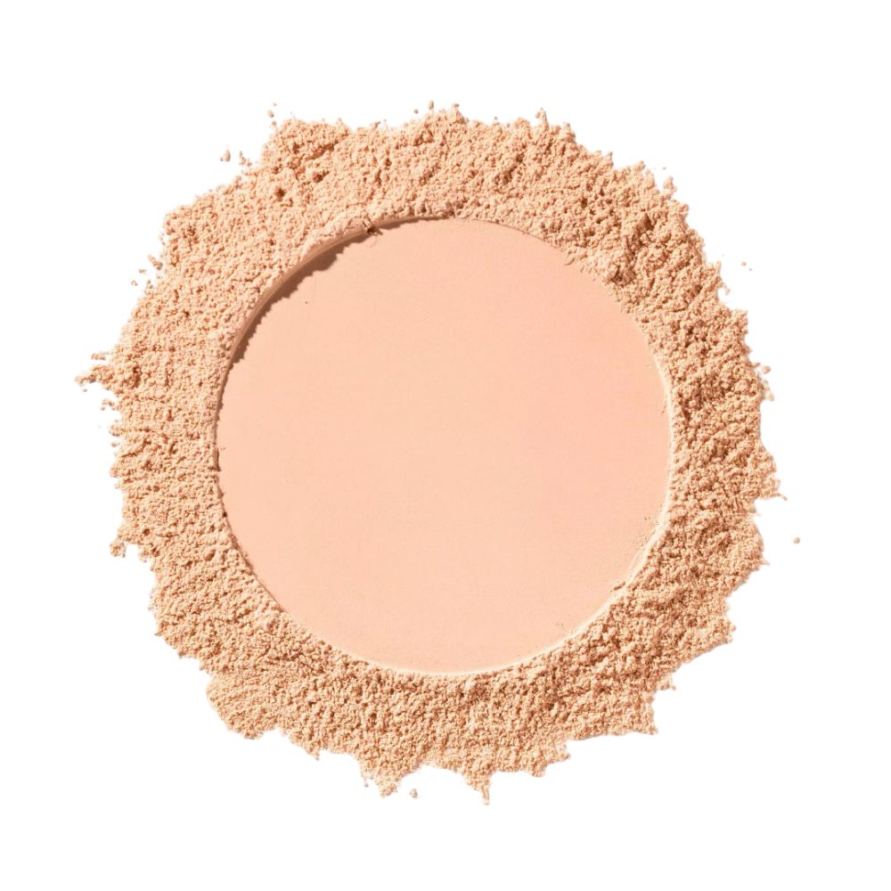 Haufen loses Puder. In der Mitte eine runde, helle Fläche. Umrandet von losem Puder.